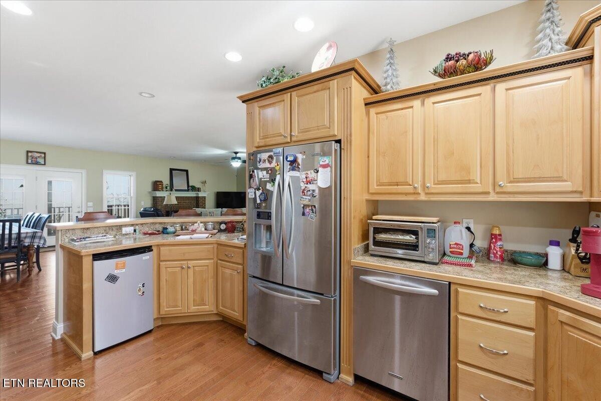 1999 Repass Road New Market, TN 37820 - Photo 12 of 52 a kitchen with stainless steel appliances a refrigerator sink and cabinets