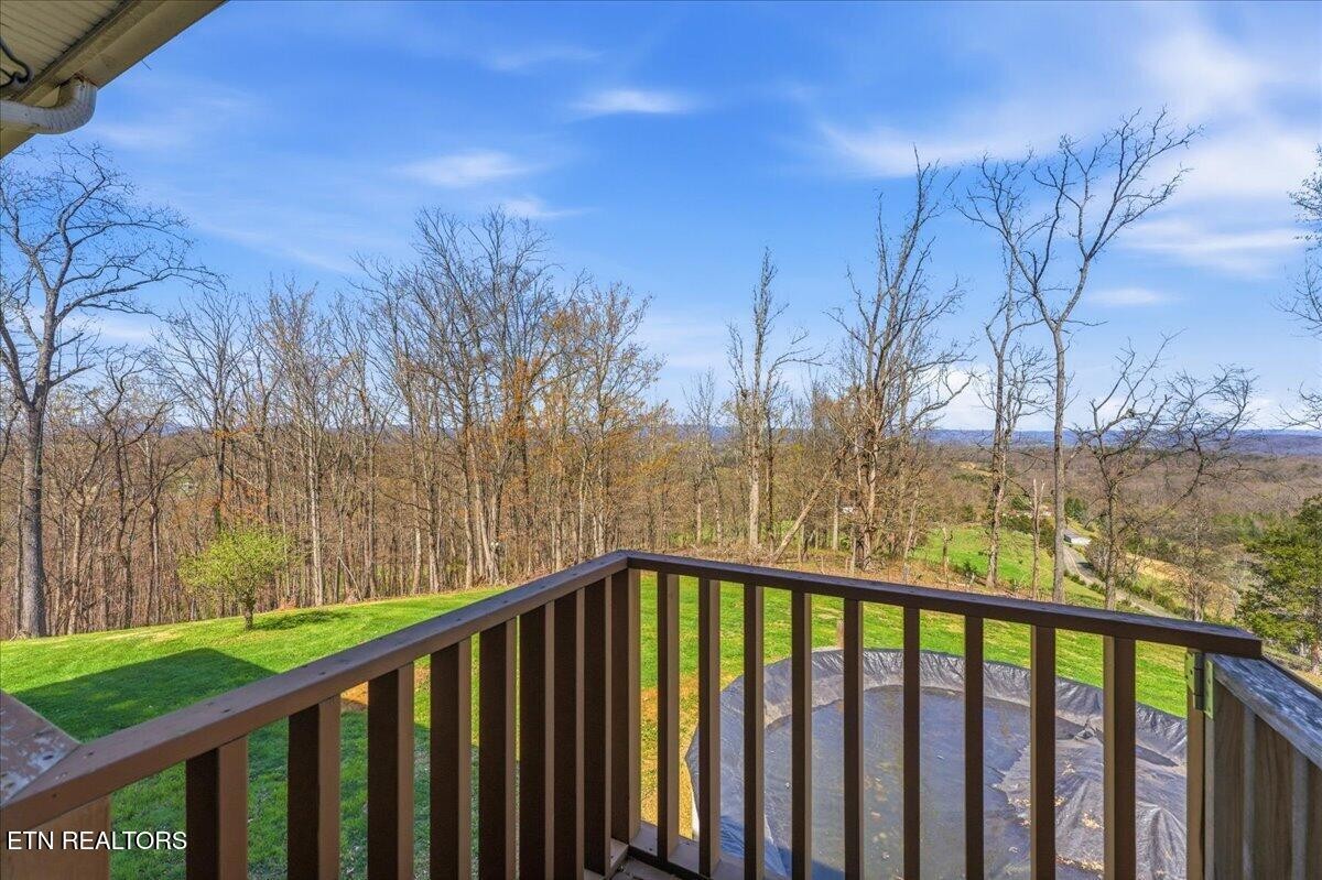 1999 Repass Road New Market, TN 37820 - Photo 16 of 52 a view of a balcony with wooden floor and fence