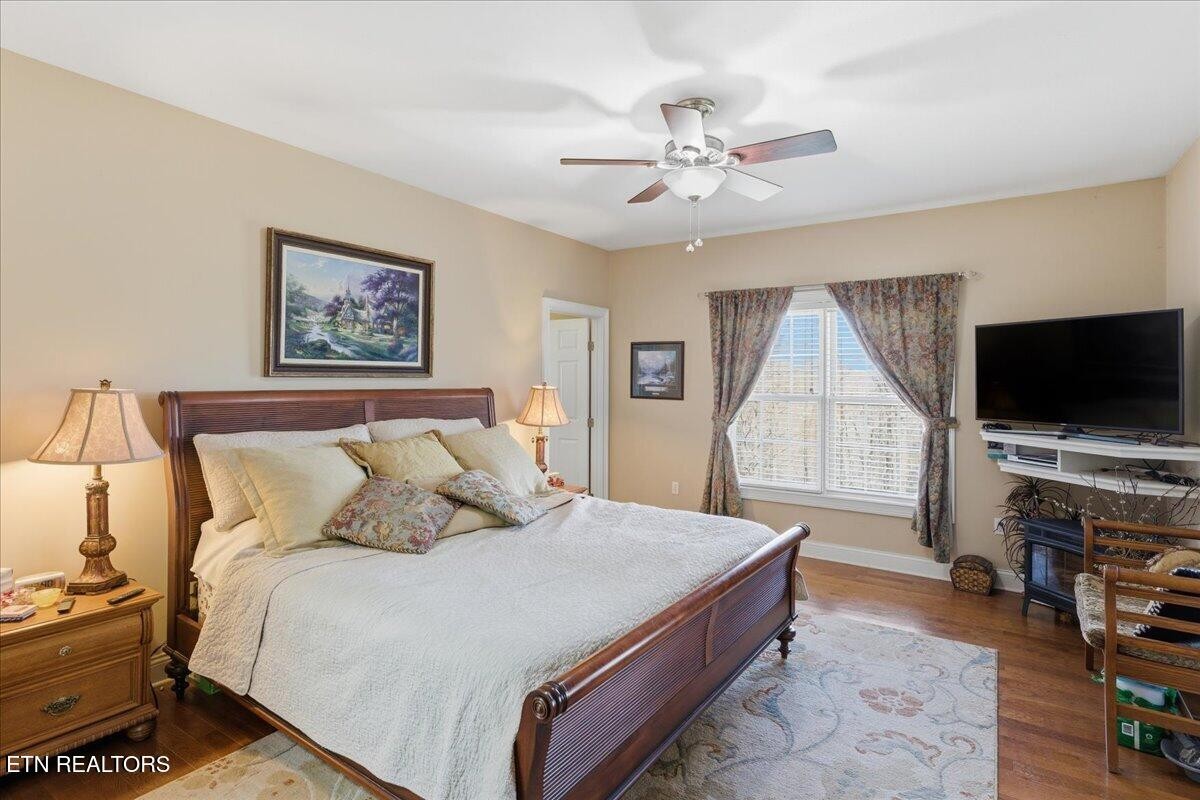 1999 Repass Road New Market, TN 37820 - Photo 18 of 52 a spacious bedroom with a bed and a flat screen tv