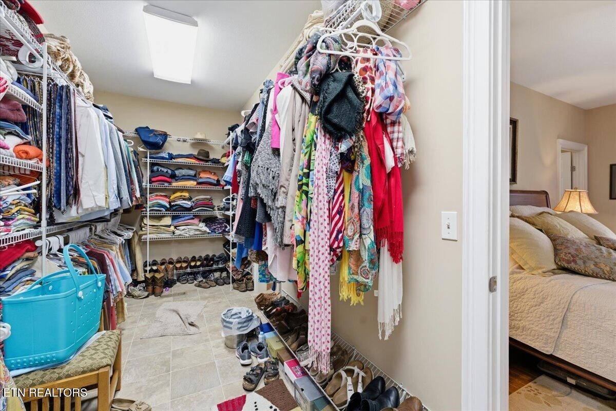 1999 Repass Road New Market, TN 37820 - Photo 22 of 52 a view of walk in closet with clothes