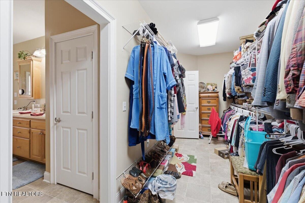 1999 Repass Road New Market, TN 37820 - Photo 23 of 52 a view of walk in closet with clothes