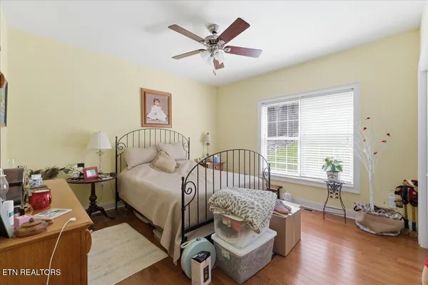 a bed room with a bed and a chair
