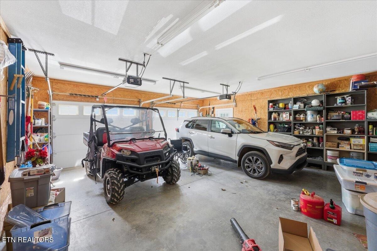 1999 Repass Road New Market, TN 37820 - Photo 28 of 52 a car and bike parked in a room