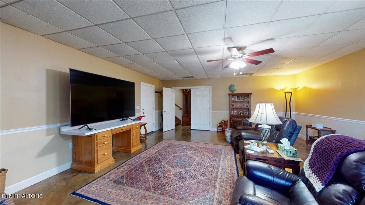 1999 Repass Road New Market, TN 37820 - Photo 30 of 52 a living room with furniture and a flat screen tv