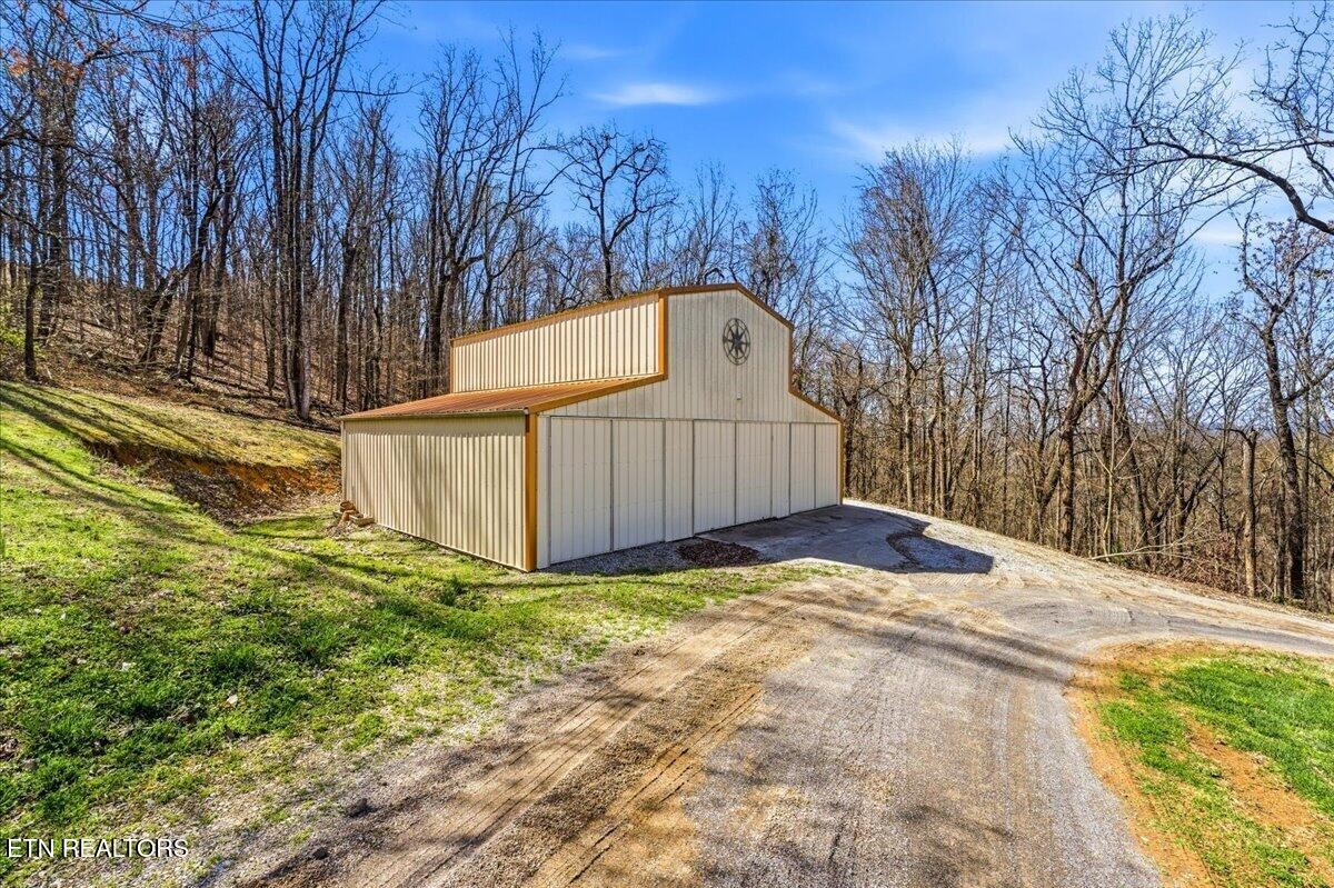 1999 Repass Road New Market, TN 37820 - Photo 44 of 52 a view of a backyard with wooden fence and large trees