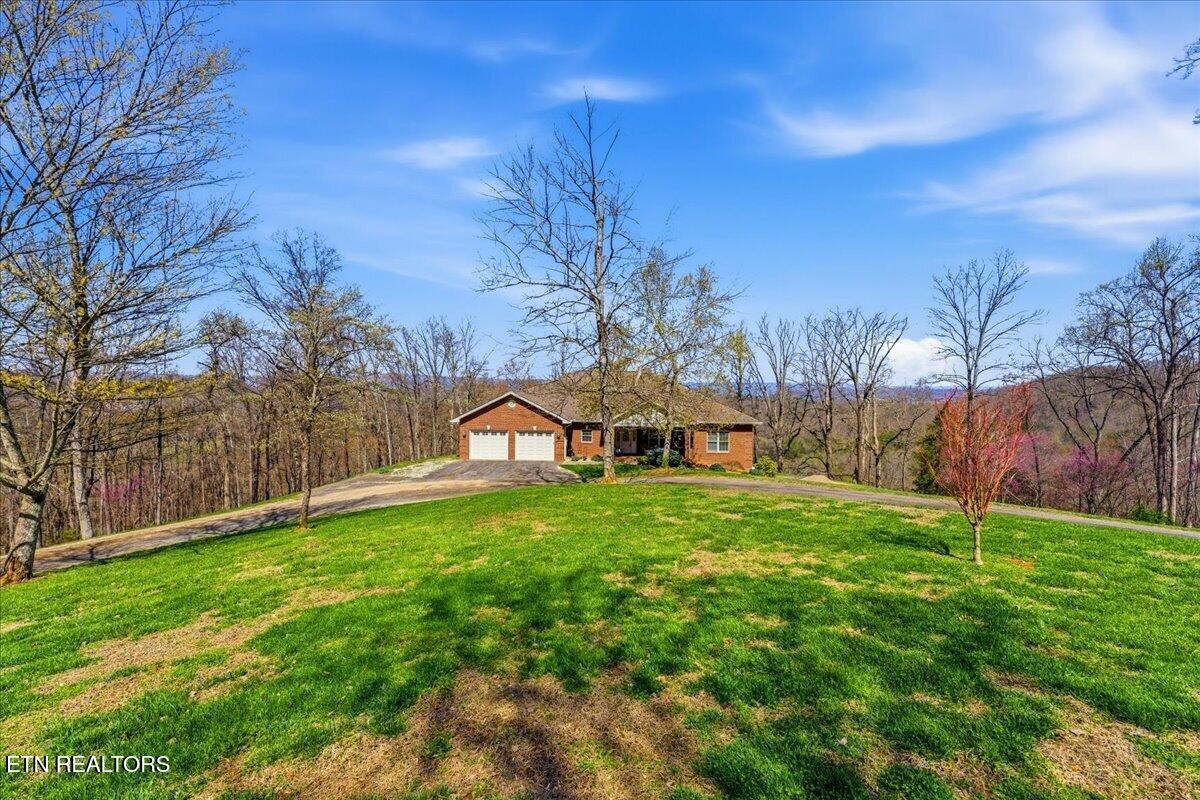 1999 Repass Road New Market, TN 37820 - Photo 45 of 52 a view of a tiny house with a yard