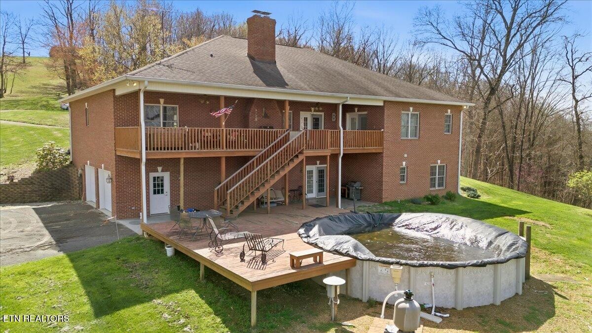 1999 Repass Road New Market, TN 37820 - Photo 49 of 52 a view of a house with backyard and porch