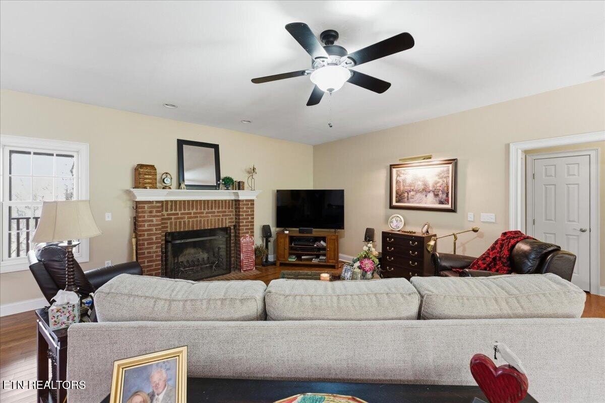1999 Repass Road New Market, TN 37820 - Photo 6 of 52 a living room with furniture and a flat screen tv