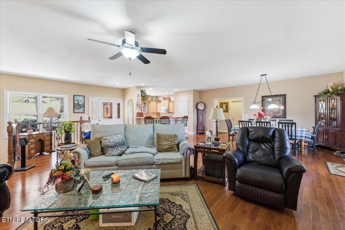 1999 Repass Road New Market, TN 37820 - Photo 7 of 52 a living room with furniture a fireplace and a chandelier