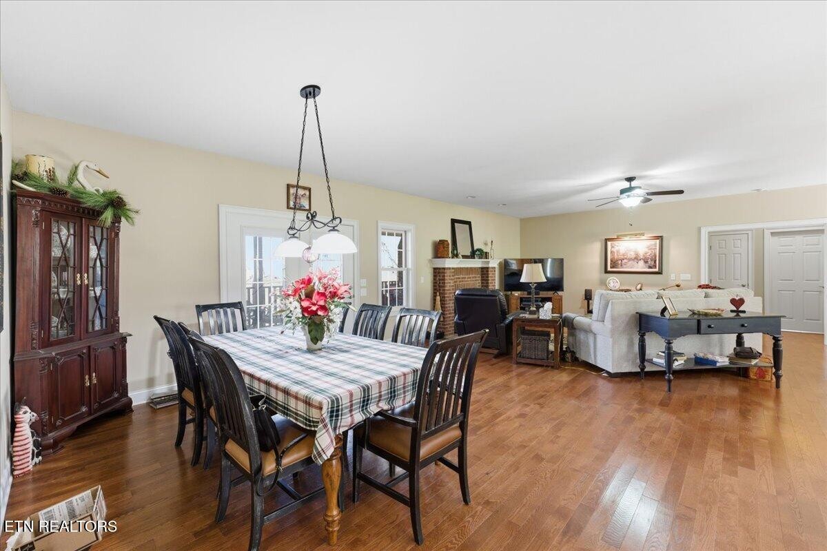 1999 Repass Road New Market, TN 37820 - Photo 9 of 52 a view of a dining room with furniture wooden floor and chandelier