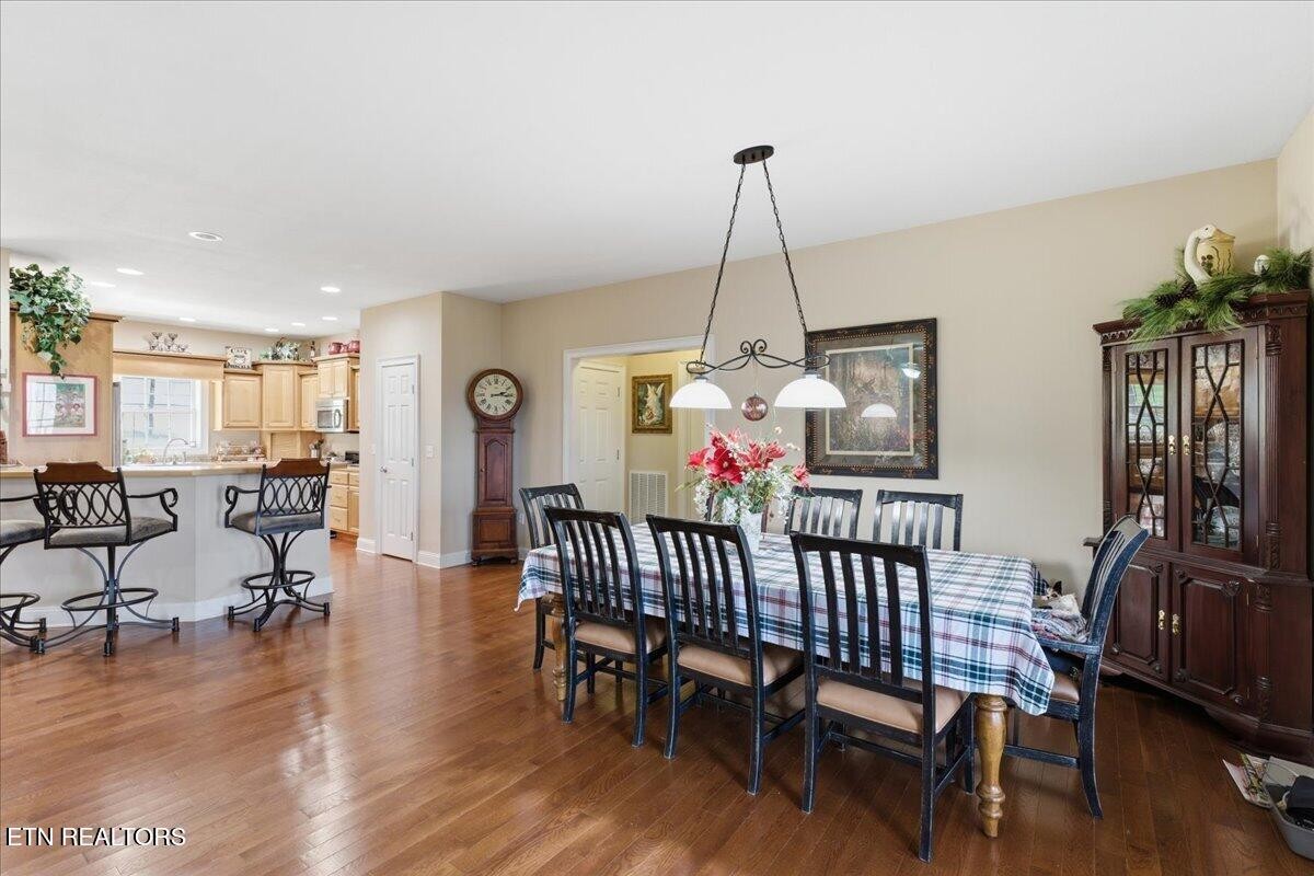 1999 Repass Road New Market, TN 37820 - Photo 10 of 52 a view of a dining room with furniture window and wooden floor