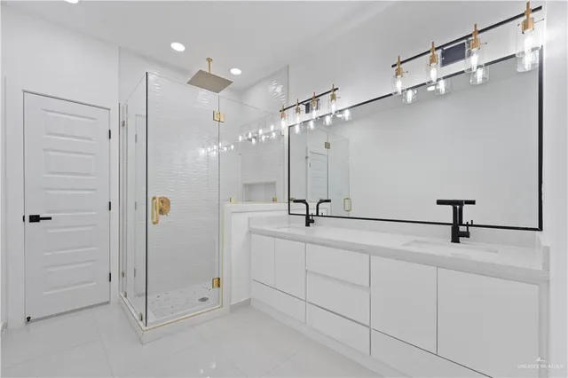 a bathroom with a shower and a sink
