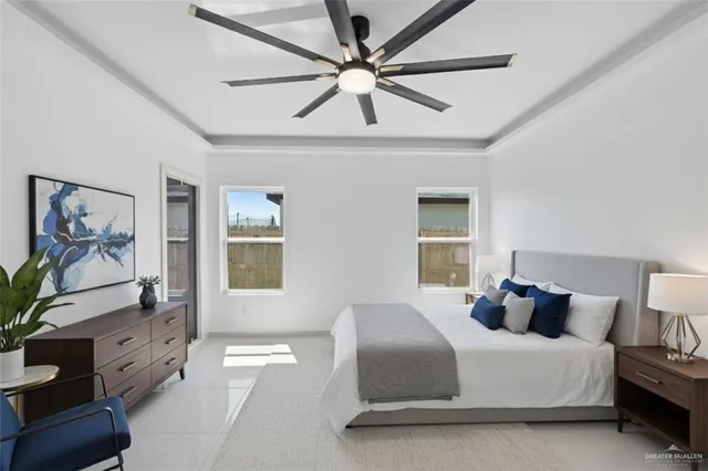 a bedroom with a bed and glass window