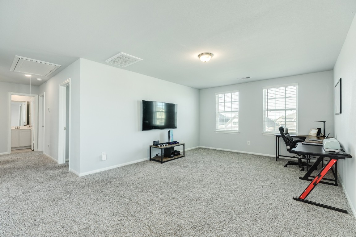 3640 Crosspointe Pass Angleton, TX 77515 - Photo 11 of 21 a view of a workspace with furniture and a window