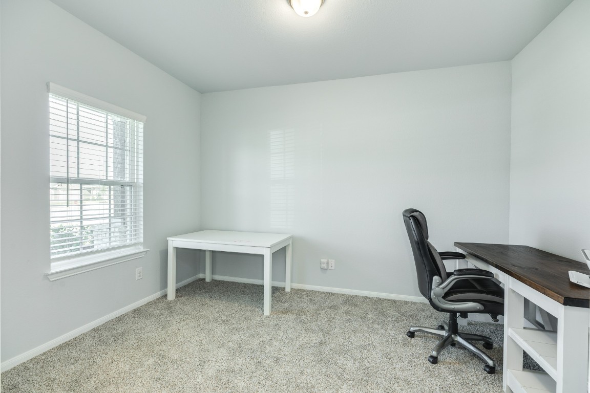 3640 Crosspointe Pass Angleton, TX 77515 - Photo 12 of 21 a view of a workspace with furniture and a window