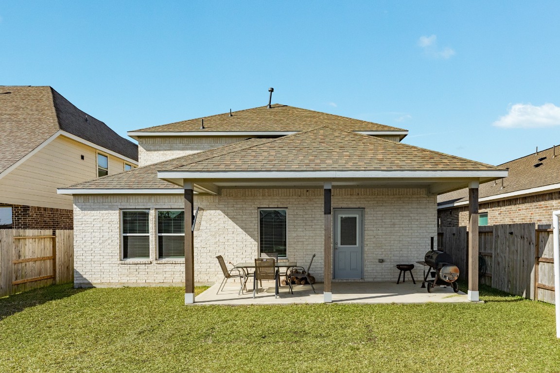 3640 Crosspointe Pass Angleton, TX 77515 - Photo 13 of 21 a backyard of a house with yard and seating space