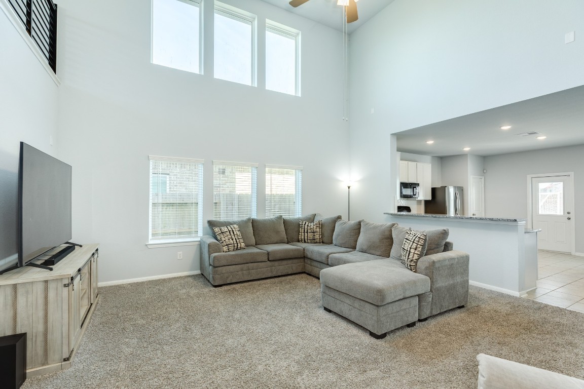 3640 Crosspointe Pass Angleton, TX 77515 - Photo 16 of 21 a living room with furniture and a flat screen tv