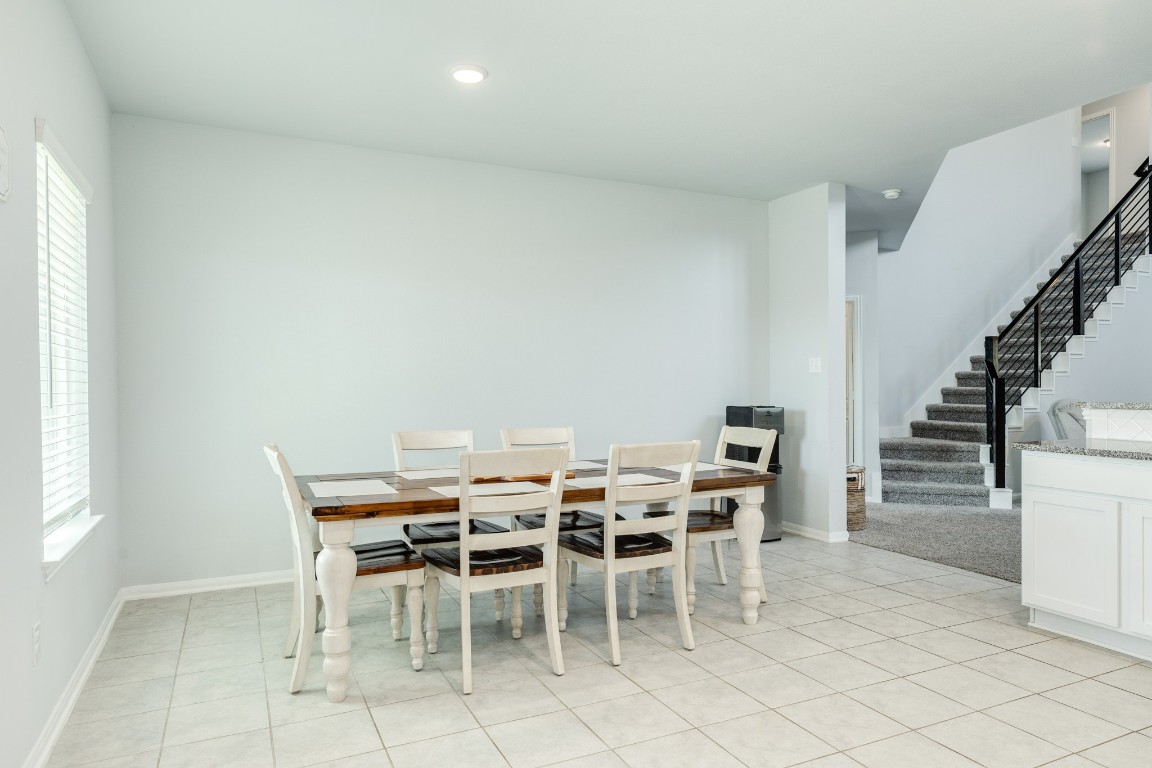 3640 Crosspointe Pass Angleton, TX 77515 - Photo 18 of 21 a view of a dining room with furniture