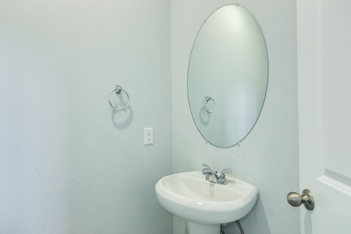 3640 Crosspointe Pass Angleton, TX 77515 - Photo 21 of 21 a bathroom with a sink and a mirror