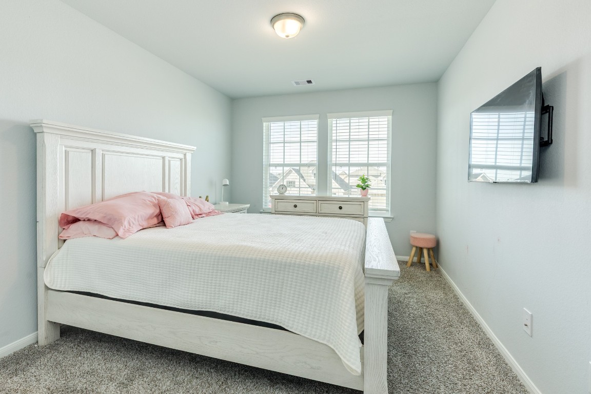 3640 Crosspointe Pass Angleton, TX 77515 - Photo 10 of 21 a bedroom with a bed and a window