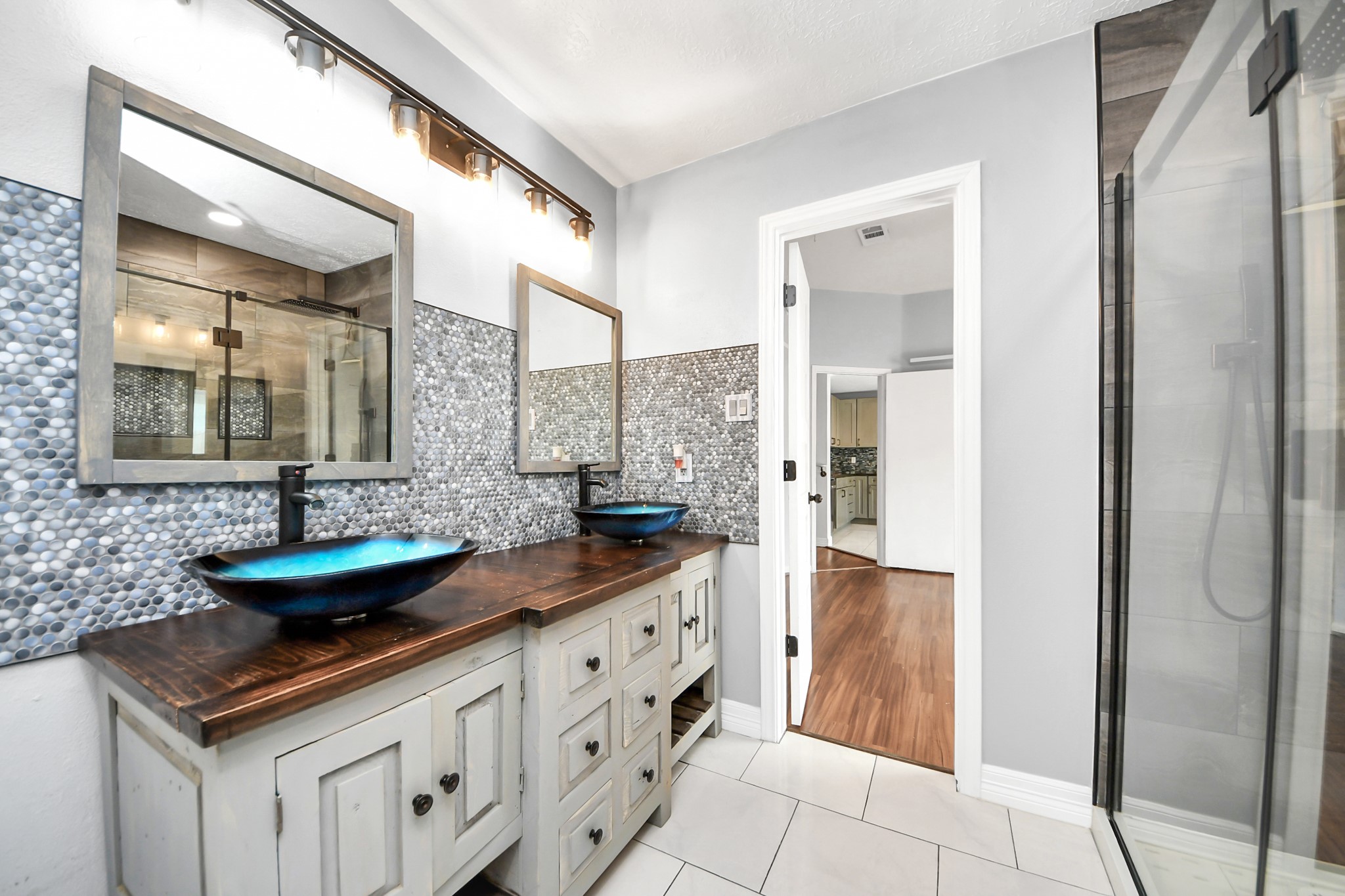 28707 Stapleford Street Spring, TX 77386 - Photo 23 of 38 a bathroom with a sink and a mirror