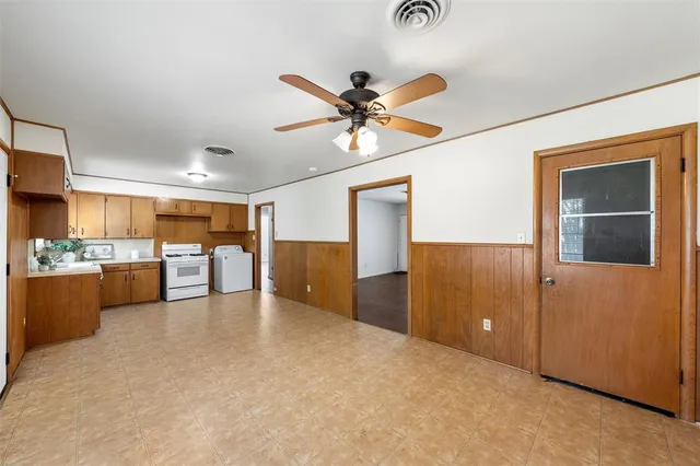 a view of a livingroom with a kitchen