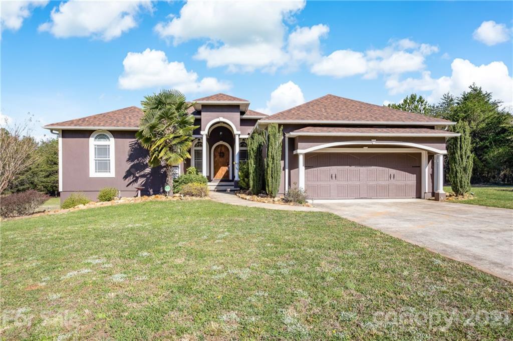 295 Brians Way Rutherfordton, NC 28139 - Photo 1 of 38 a front view of a house with garden
