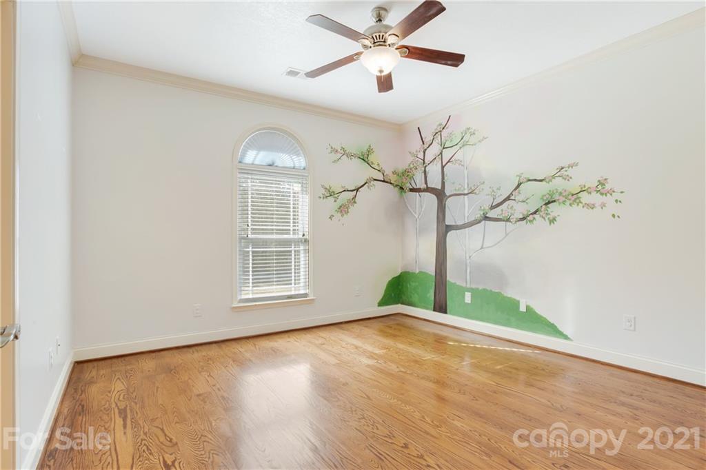 295 Brians Way Rutherfordton, NC 28139 - Photo 14 of 38 a view of empty room with wooden floor and fan