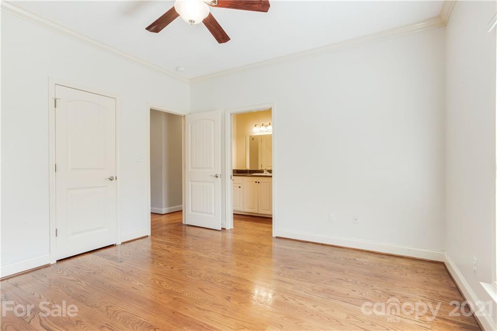 295 Brians Way Rutherfordton, NC 28139 - Photo 15 of 38 an empty room with wooden floor and a ceiling fan