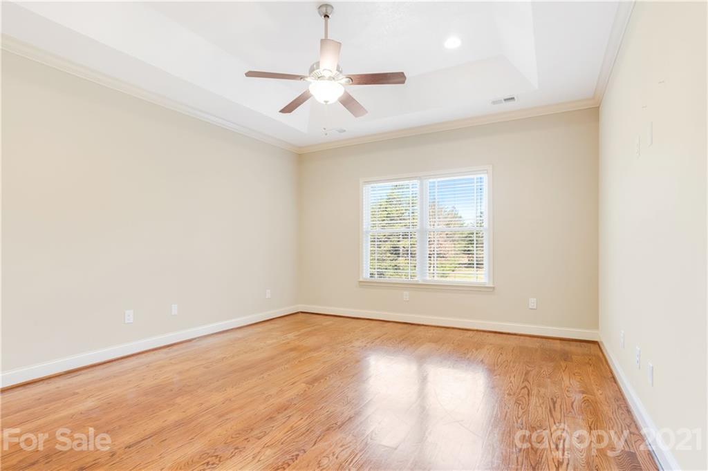 295 Brians Way Rutherfordton, NC 28139 - Photo 16 of 38 an empty room with wooden floor fan and windows