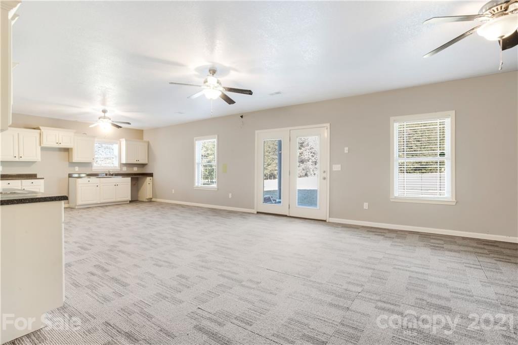 295 Brians Way Rutherfordton, NC 28139 - Photo 23 of 38 a view of a kitchen with furniture and a ceiling fan
