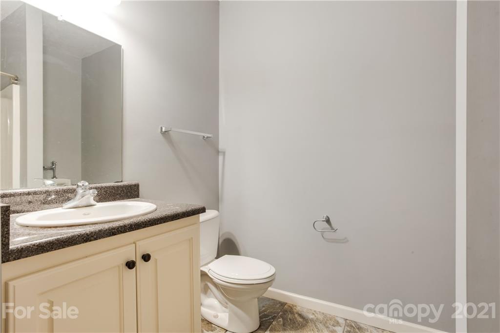 295 Brians Way Rutherfordton, NC 28139 - Photo 26 of 38 a bathroom with a granite countertop toilet and a sink