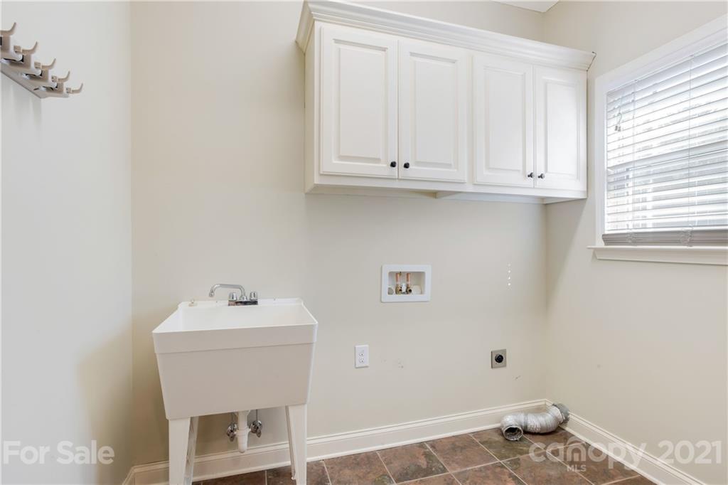 295 Brians Way Rutherfordton, NC 28139 - Photo 29 of 38 a bathroom with a sink and cabinets