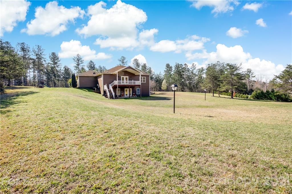 295 Brians Way Rutherfordton, NC 28139 - Photo 32 of 38 a view of a house with a yard and sitting area