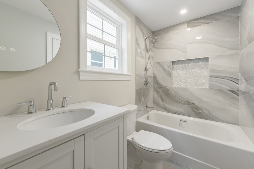 25 Locust Street, Unit 1 Winthrop, MA 02152 - Photo 20 of 38 a bathroom with a sink a toilet and a bathtub