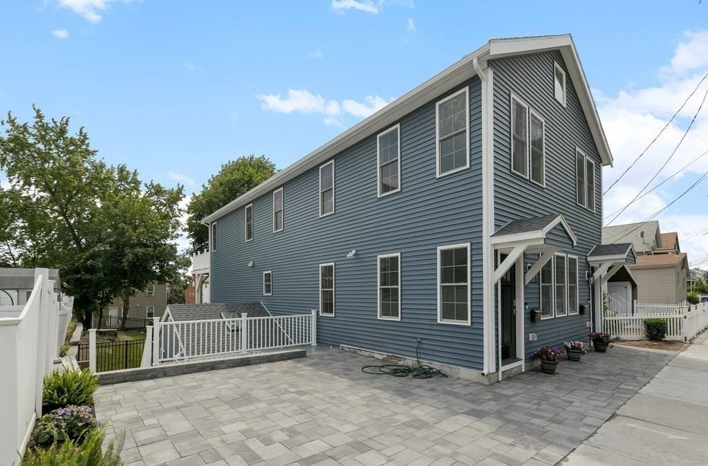 25 Locust Street, Unit 1 Winthrop, MA 02152 - Photo 2 of 38 a view of a house with a yard