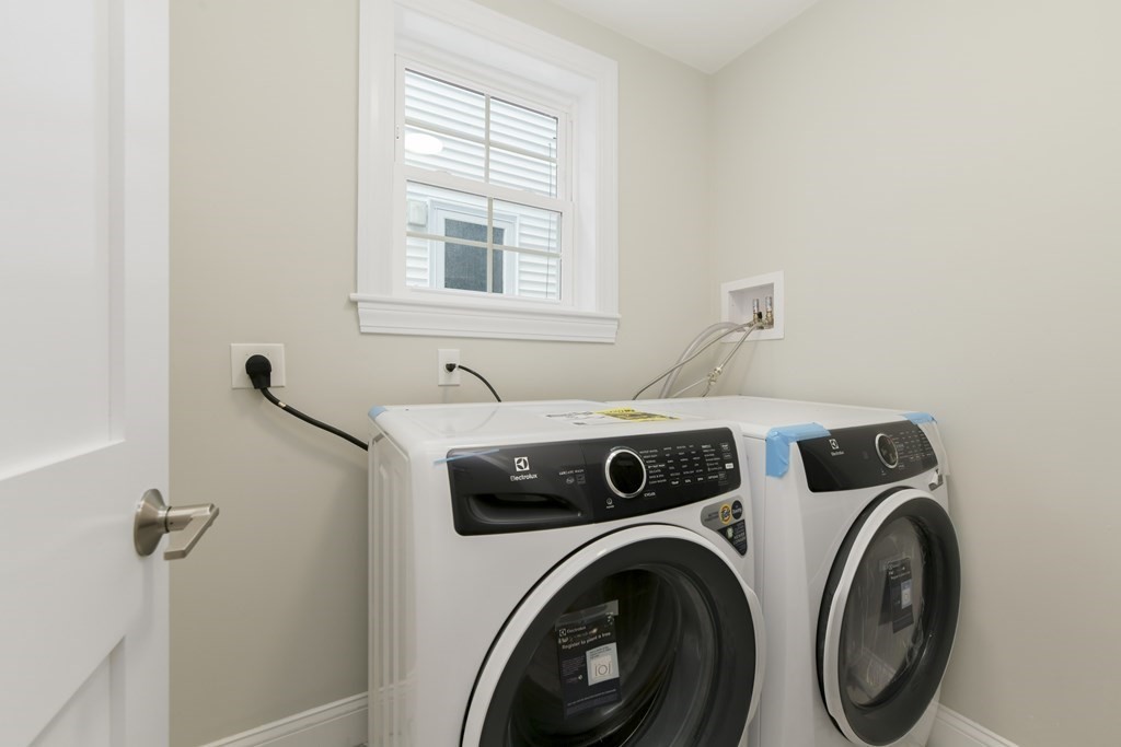 25 Locust Street, Unit 1 Winthrop, MA 02152 - Photo 22 of 38 a utility room with dryer and washer
