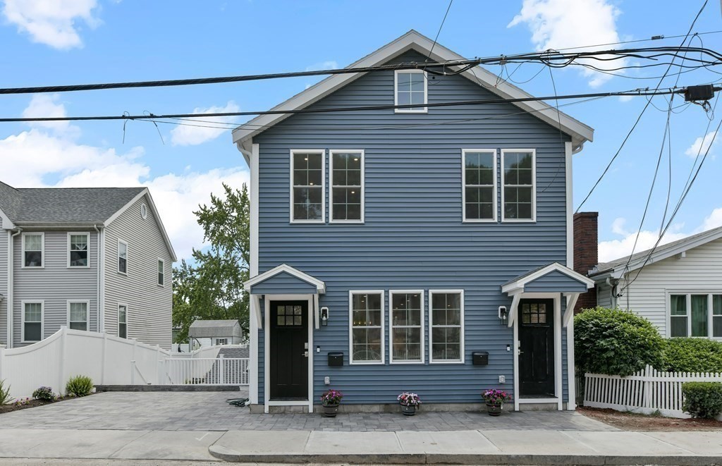 25 Locust Street, Unit 1 Winthrop, MA 02152 - Photo 3 of 38 a front view of a house with a garage