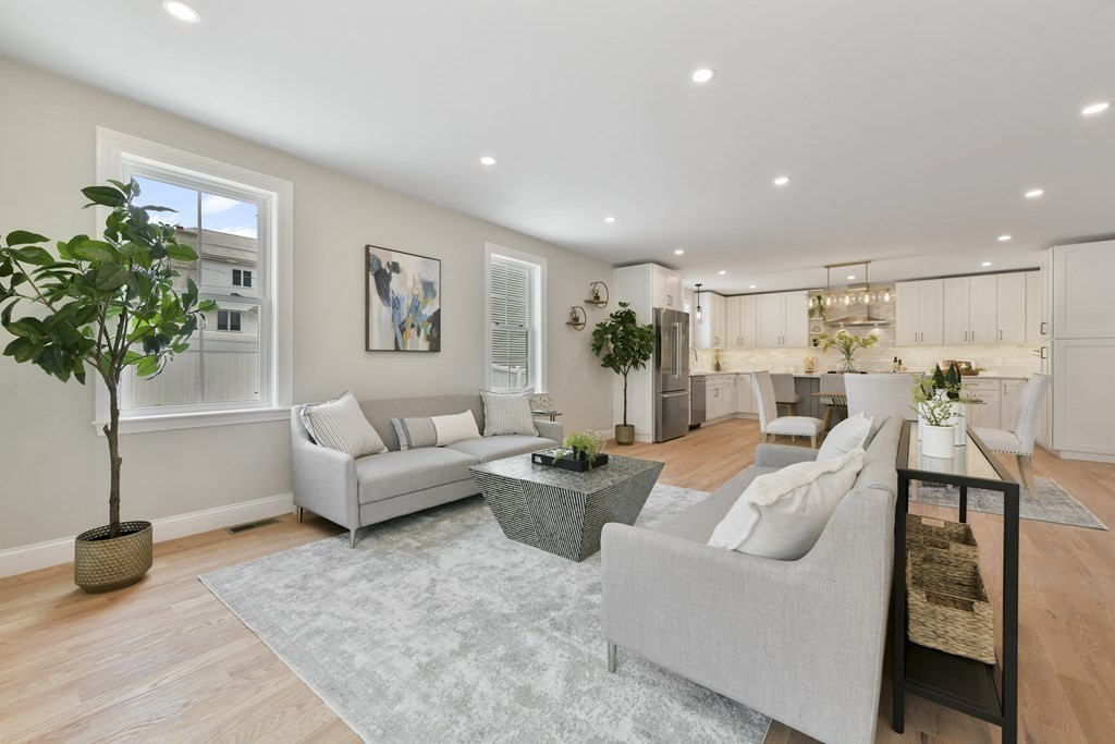 25 Locust Street, Unit 1 Winthrop, MA 02152 - Photo 5 of 38 a living room with furniture and a potted plant