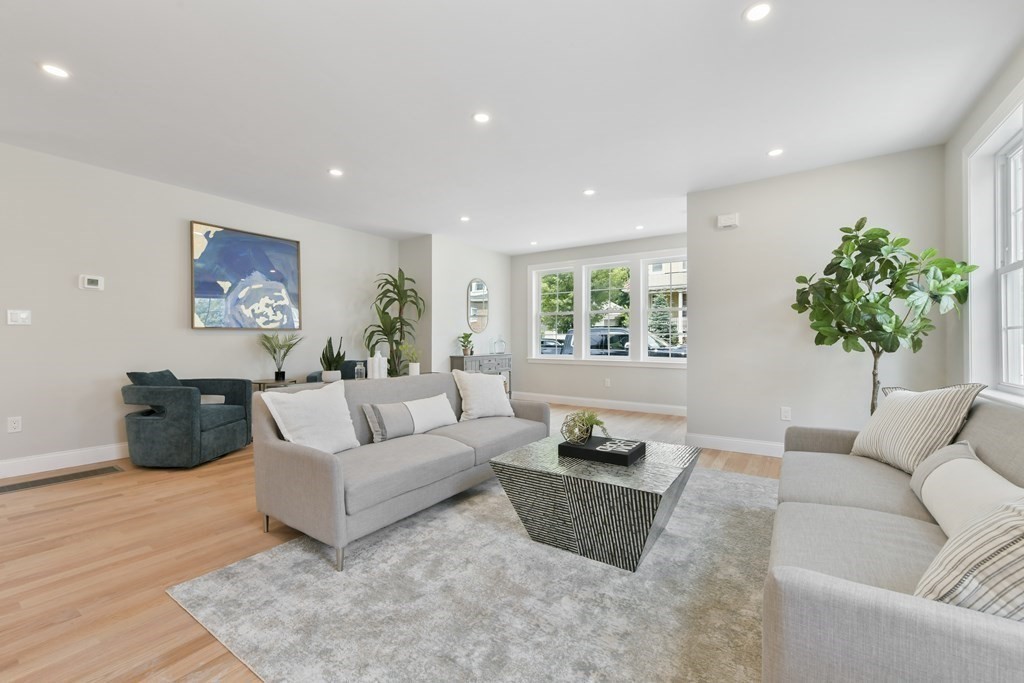 25 Locust Street, Unit 1 Winthrop, MA 02152 - Photo 7 of 38 a living room with furniture and a potted plant