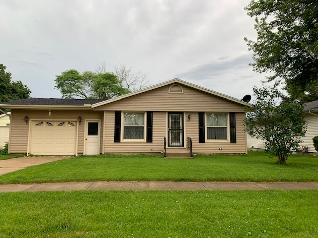 209 Southview Drive Rochelle, IL 61068 - Photo 1 of 16 a front view of a house with a yard and trees