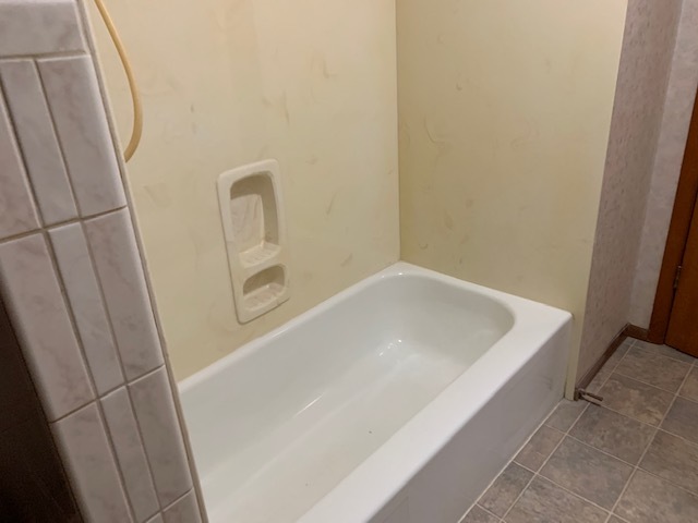 209 Southview Drive Rochelle, IL 61068 - Photo 11 of 16 a bath tub sitting next to a white sink