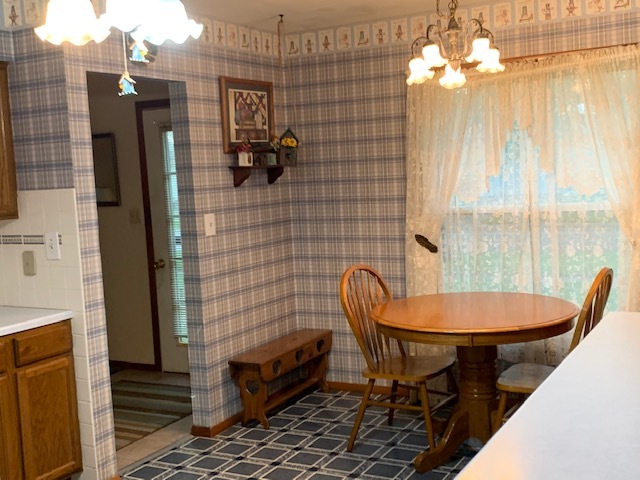 209 Southview Drive Rochelle, IL 61068 - Photo 4 of 16 a view of a dining room with furniture window and outside view