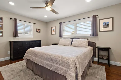 a bedroom with a large bed and a window