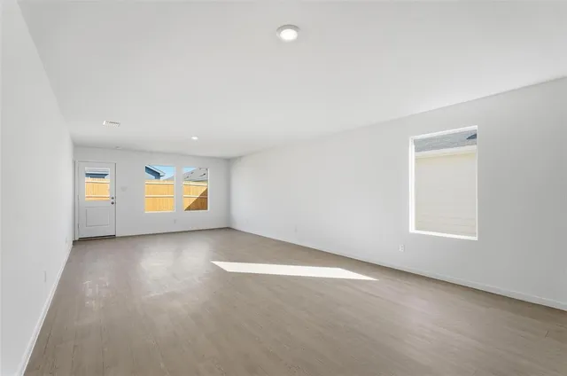 a view of a hallway to rooms