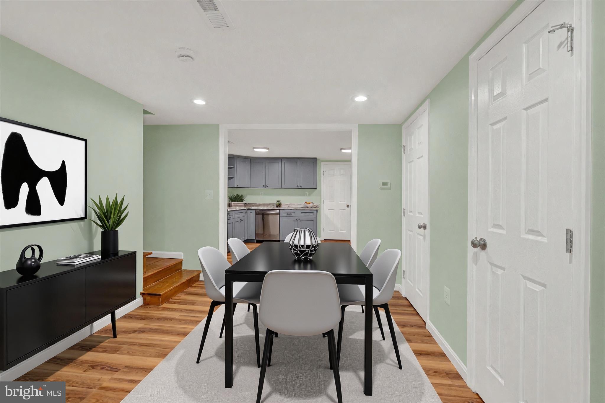 8511 Frederick Road Ellicott City, MD 21043 - Photo 4 of 36 a view of a dining room with furniture and wooden floor
