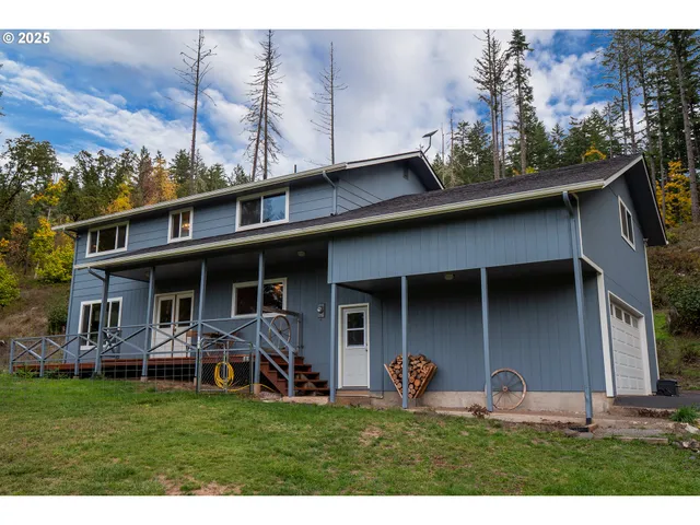 a view of a porch with furniture and garden