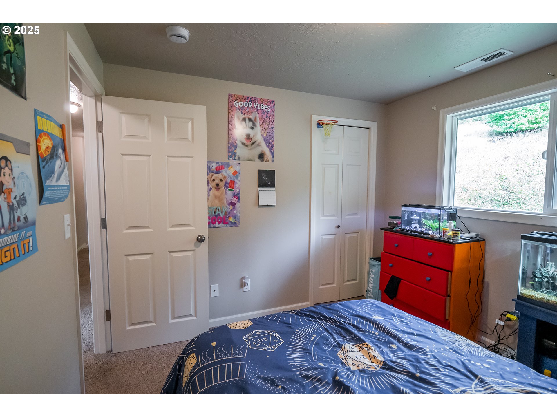 76377 Mosby Creek Road Cottage Grove, OR 97424 - Photo 16 of 48 a bedroom with a bed and a window