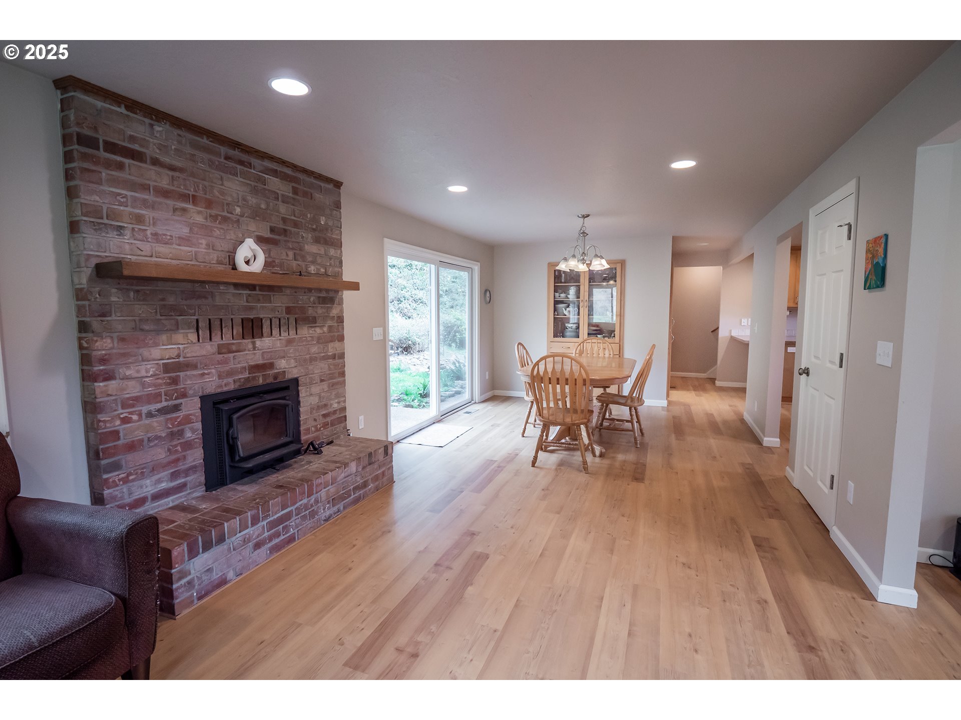 76377 Mosby Creek Road Cottage Grove, OR 97424 - Photo 3 of 48 a living room with furniture and a fireplace