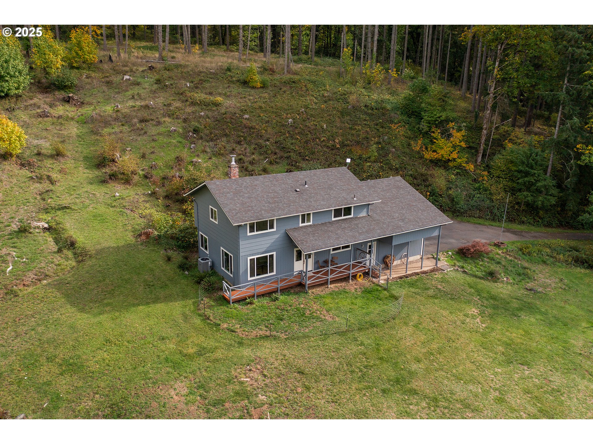 76377 Mosby Creek Road Cottage Grove, OR 97424 - Photo 44 of 48 a aerial view of residential houses with outdoor space and trees